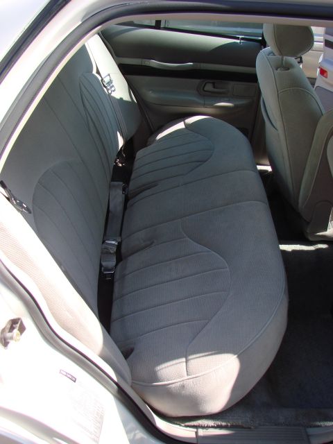 1997 Mercury Grand Marquis - Took out the back seat bottom cushion. Just push the front of the cushion towards the trunk and then up.