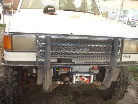 1989 Ford Bronco - Front view of a 1989 Ford Bronco, equipped with a winch and brush guard.