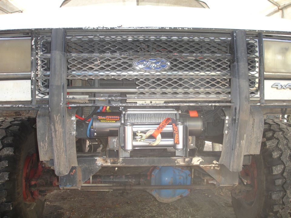Front of Ford truck with a winch mounted behind the grille guard. Has a Ford logo on the grille and '4x4' badge visible