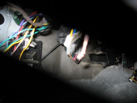 1995 Ford C-350 (Centurion Conversions) - Close-up of a vehicle's interior wiring harness, showing a complex network of wires.