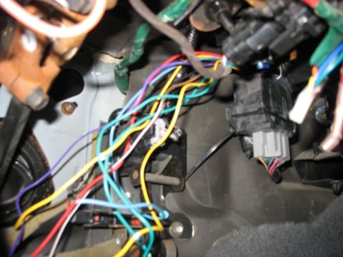 1995 Ford C-350 (Centurion Conversions) - Close-up view of a complex vehicle wiring harness, showing numerous colorful wires and electrical connectors.