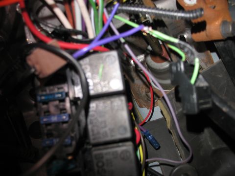 1995 Ford C-350 (Centurion Conversions) - A complex network of wires and relays is visible within the vehicle's electrical system.