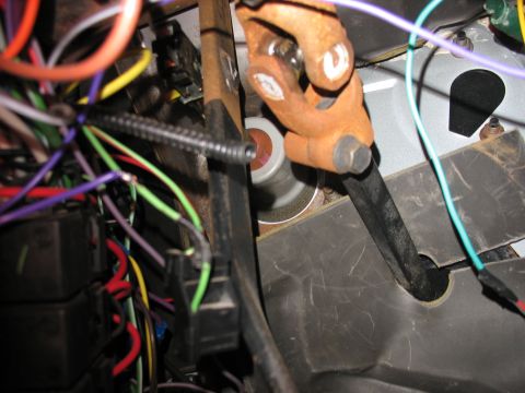 1995 Ford C-350 (Centurion Conversions) - Interior view of a vehicle's steering column with complex wiring and a U-joint visible.