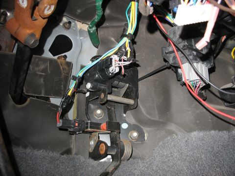 1995 Ford C-350 (Centurion Conversions) - The complex wiring harness and pedal assembly are visible under the dashboard of the vehicle.
