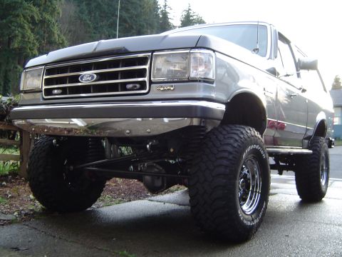 1989 Ford Bronco - This lifted 1989 Ford Bronco features aggressive off-road tires and a prominent grille, its capabilities.