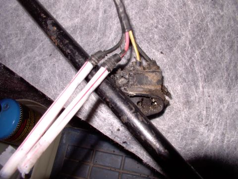 1990 Lincoln Town Car - Here's the two corroded terminals, busted loose out of the crumbling original connector, soaking in two straws filled with vinegar (acid).