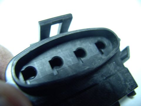 1990 Lincoln Town Car - The metal tangs slip into the little recesses to the left of each socket hole with a satisfying positive "click", locating the terminals ri…