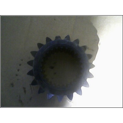 1972 Ford Ranchero - A close-up view of a gear with prominent teeth, likely a mechanical component.