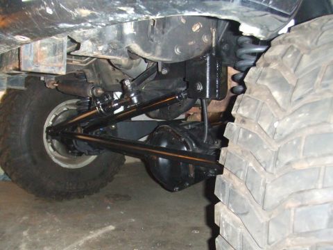 1996 Ford Bronco - Close-up view of the suspension and drivetrain components of a vehicle.
