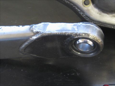 1996 Ford Bronco - Welded suspension part with a bearing, likely for a vehicle's front suspension.