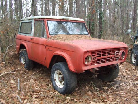 1967 Ford Bronco - Body is a '67 which is also sitting in the woods and needs some TLC.