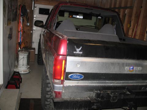 1995 Ford Bronco - The rear of a Ford Bronco, likely from the late 1980s, is shown in a garage setting.