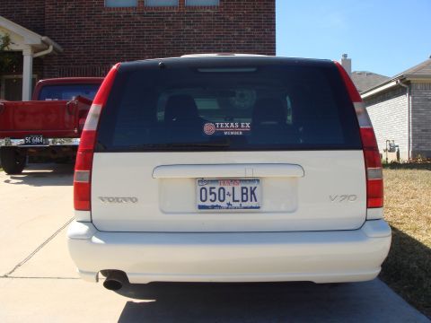 1998 Volvo V70 - Rear view of a white Volvo V70 wagon, a Texas license plate and a 'Texas Ex Member' sticker on the rear window.