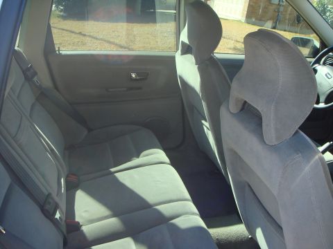 1998 Volvo V70 - Interior view of the back seat and door panel of a car, with a watermark at the bottom.