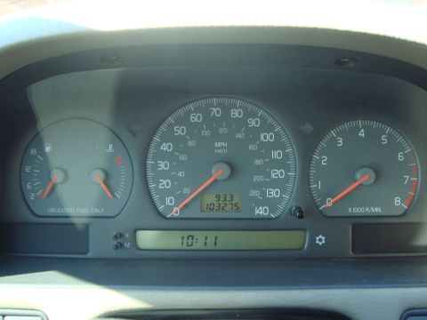 1998 Volvo V70 - The car's dashboard displays the speedometer, tachometer, fuel gauge, and digital clock.