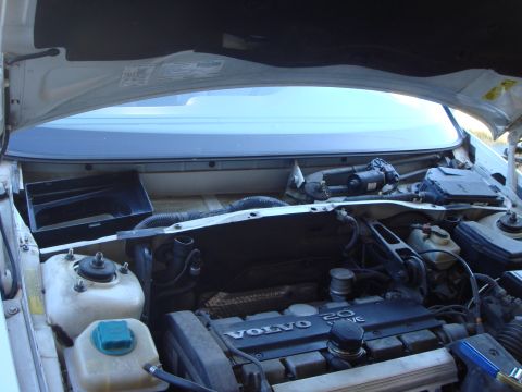 1998 Volvo V70 - With the wipers and cowl removed. The cabin air filter goes in that black box on the passenger side.