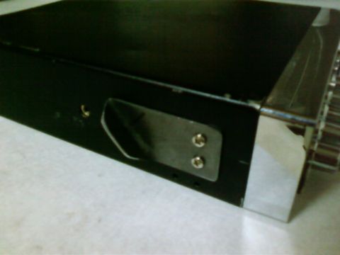 1995 Ford Bronco - A black CB radio mount with chrome trim is shown from a close-up angle.