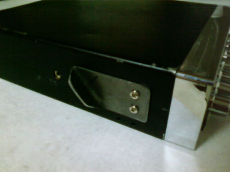 Black CB radio mount with two screws, chrome trim, and a silver bracket