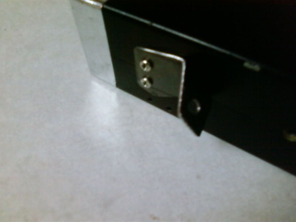 Black ashtray CB mount with chrome trim and metal bracket