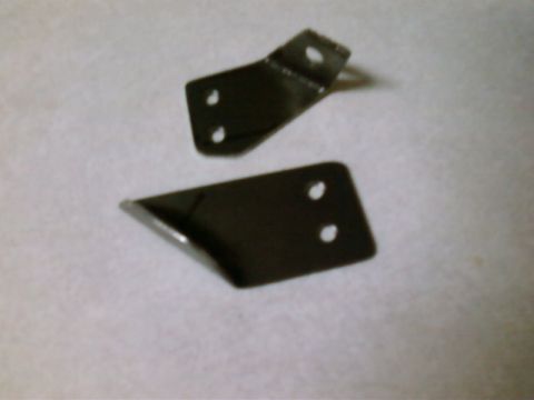 1995 Ford Bronco - Two metal brackets, likely for mounting an accessory, are shown against a neutral background.