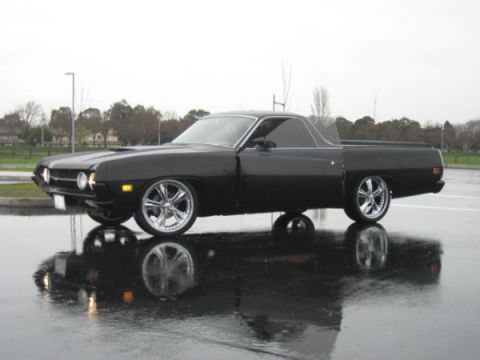 1970 Ford Ranchero - 1970 Ford Ranchero in black, seen from a 3/4 front angle on a rainy day.