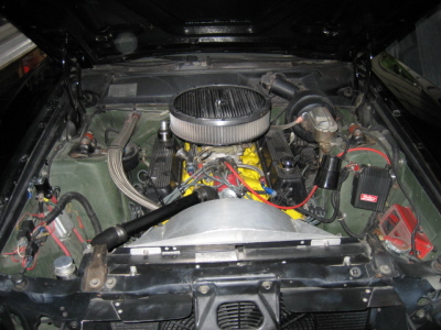 1970 Ford Ranchero - Engine bay view of a V8 engine with custom components and visible SuperMotors branding.