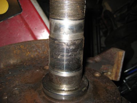 1991 Ford Bronco - A close-up view of a threaded metal part, likely from a vehicle's drivetrain.