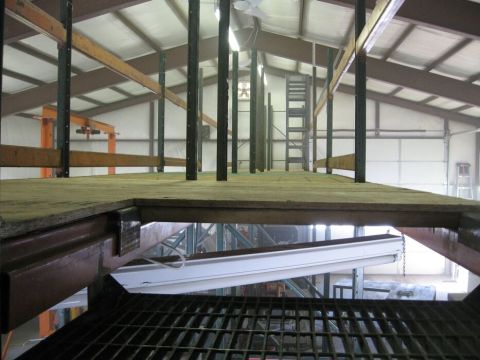 1986 Ford Ranger - Interior view of a warehouse mezzanine level, showing structural beams and flooring.