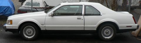 1990 Lincoln Mark VII - This 1990 Lincoln Mark VII coupe is shown from the side, wire wheels and a sunroof.