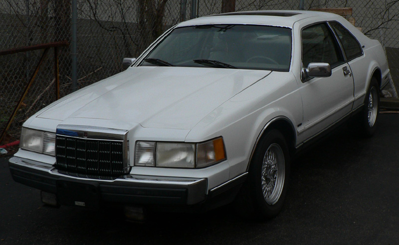 White 1990 Lincoln Mark VII coupe from a 3/4 front angle