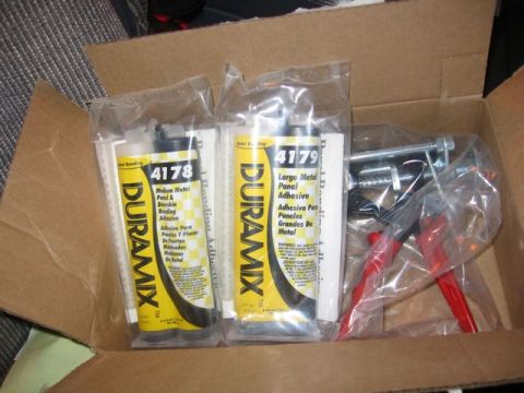 1989 Ford Bronco - A box contains two tubes of Duramix panel adhesive and a metal applicator gun.