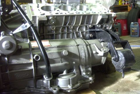 1997 Ford Taurus - A Ford engine block and transmission assembly is shown, with a "Ford" logo visible on the transmission casing.