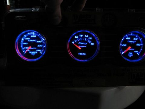 1998 Lincoln Town Car - A close-up view of three illuminated Cobalt gauges, showing water temperature, voltage, and oil pressure readings.