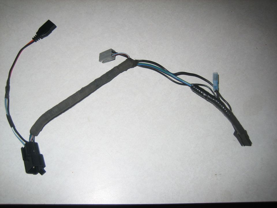 Wiring harness with black and gray connectors, fabric-wrapped section, and blue and black wires