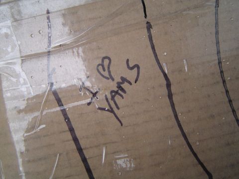 1989 Ford Bronco - Cardboard box with marker writing and tape. No vehicle is visible.
