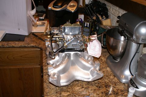 1972 Ford Ranchero - Aftermarket intake manifold and carburetor assembly on a kitchen counter.