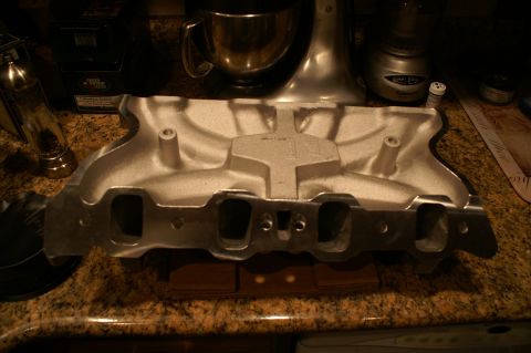 1972 Ford Ranchero - An aluminum intake manifold is shown on a countertop, likely before installation.