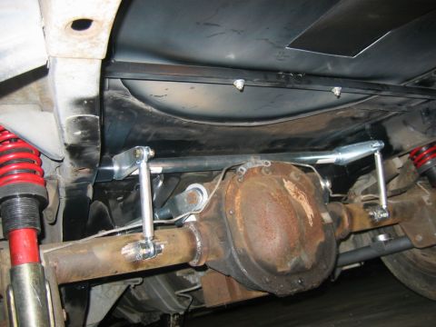 1992 Ford Mustang - The rear axle and suspension system of a vehicle are shown from underneath, highlighting custom modifications.
