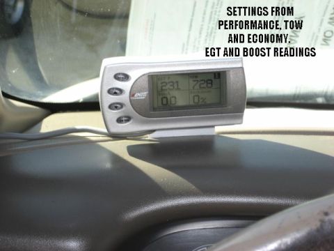2000 Ford F-250 - A digital gauge displays EGT and boost readings, with settings for performance, tow, and economy modes.