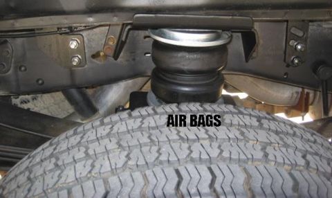 2000 Ford F-250 - The photo shows air bags installed on the suspension system of a vehicle.