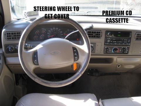 2000 Ford F-250 - The interior of a 2000 Ford F-250 features a steering wheel and dashboard with humorous text labels.