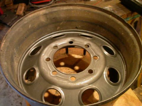 1990 Ford Bronco - New wheel center dropped all the way into wheel and resting on the wheels lower lip.