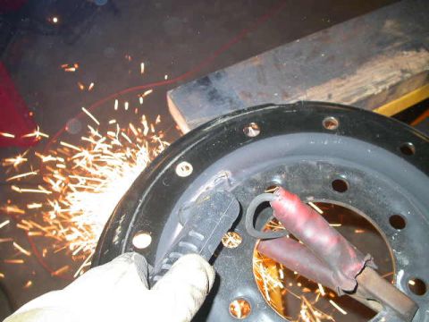 1990 Ford Bronco - The ridge on the outer rim acts as a guide for the plasma cutter. I found it was easiest to make a smooth cut by rotating the rim under the…