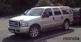 2005 Ford Excursion - Silver 2005 Ford Excursion parked in a lot, showing its front and side profile.