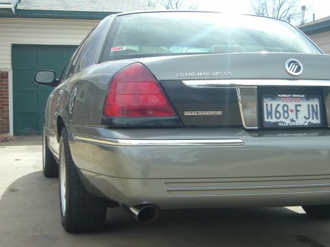 2003 Mercury Grand Marquis - Rear view of a gray 2003 Mercury Grand Marquis Police Interceptor, showing the "Police Interceptor" badging.
