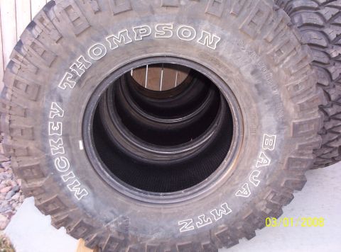 1995 Ford Bronco - A stack of Mickey Thompson Baja MTZ tires is shown. The registry claims this is a 1995 Ford Bronco, but the photo shows only tires.