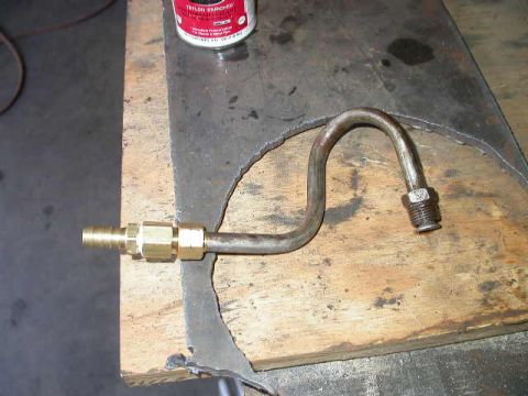 1990 Ford Bronco - Bent tube 90 degrees, then added a 3/8" compression fitting to 1/4" NPT adapter, which allowed me to hook on a 3/8" barb fitting.