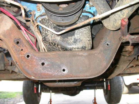 1990 Ford Bronco - With the stock power steering cooler out of the way I now have room to cut out the front side of the cross member.