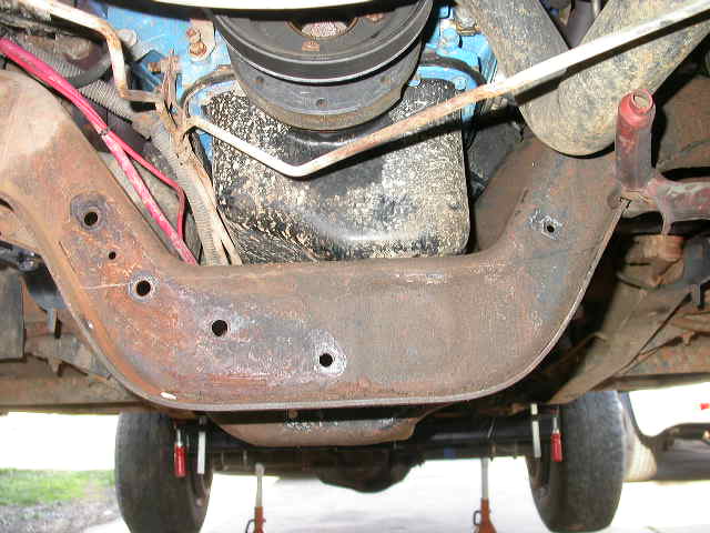 With the stock power steering cooler out of the way I now have room to cut out the front side of the cross member.