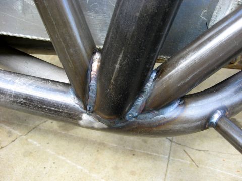1995 Ford Bronco - The photo shows a close-up of welded metal tubing, possibly part of a custom vehicle frame or roll cage.